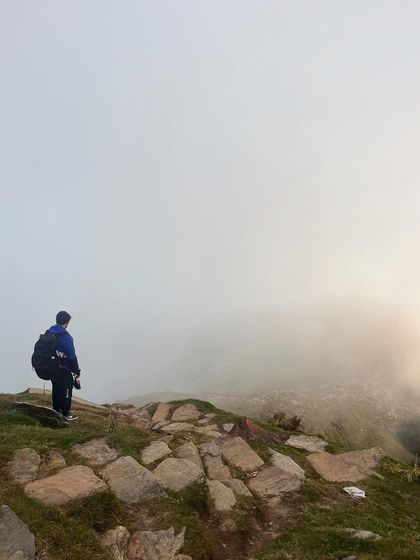 "It’s not the mountain we conquer, but ourselves." Standing in the fog on the way to Triund, a powerful reminder of the mental aspect of endurance challenges.