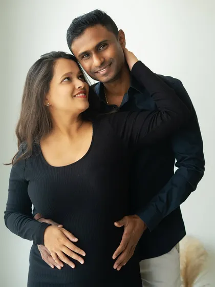 The loving gaze between a couple says everything. This intimate close-up from a lifestyle session captures the deep connection and shared joy of expecting parents.