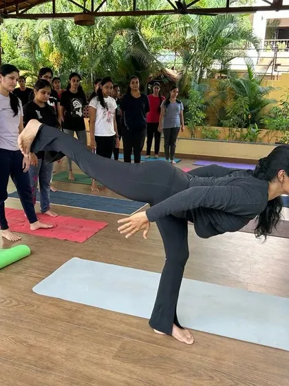 Demonstrating the full expression of Virabhadrasana III (Warrior III) for my students. This pose requires focus, strength, and control, and I guide the class through each step to build their confidence.