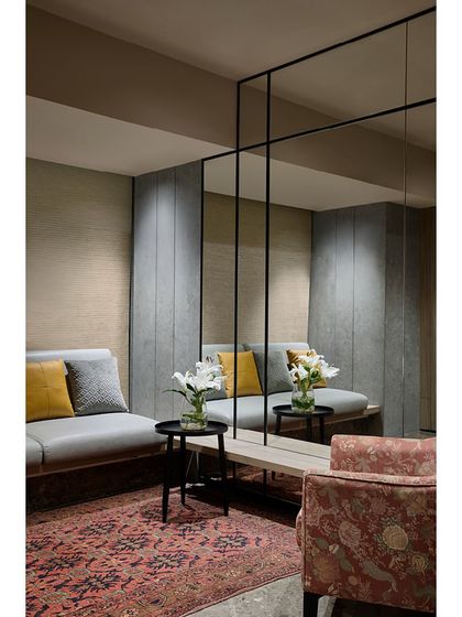 The previously underutilized mezzanine at the Blue Sea Banquet. We transformed it into a functional extension with additional seating and a dressing room, using mirrored paneling to add depth and style.