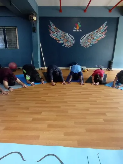 After a dynamic flow, we cool down with restorative poses like Balasana (Child's Pose). This helps calm the nervous system and release tension.