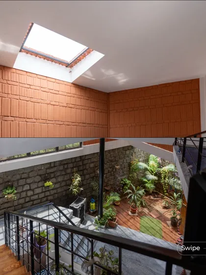 An overhead view of the Gifty Residence, showing the central courtyard and skylight that brings the outdoors in. This design feature is key to my climate-responsive approach, providing natural light and passive cooling to reduce energy use. The combination of the open sky, lush greenery, and earthy stone walls creates a living, breathing core for the home.