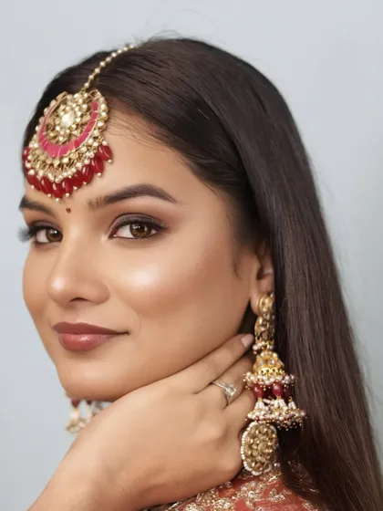 A close-up of the 'Riwayat' look, showcasing the soft brown smokey eye with a hint of shimmer and the flawless, dewy base. This is bridal beauty that is elegant, subtle, and truly timeless.