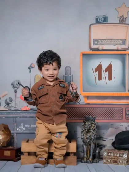 Celebrating an 11-month milestone with a retro flair. I can customize the props, like adding the number '11' to the vintage TV screen, to personalize your baby's photoshoot.