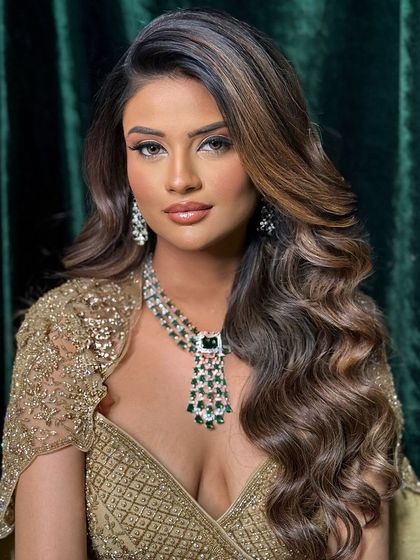 A close-up of the masterclass look, showing the soft texture and beautiful color dimension in the hair.