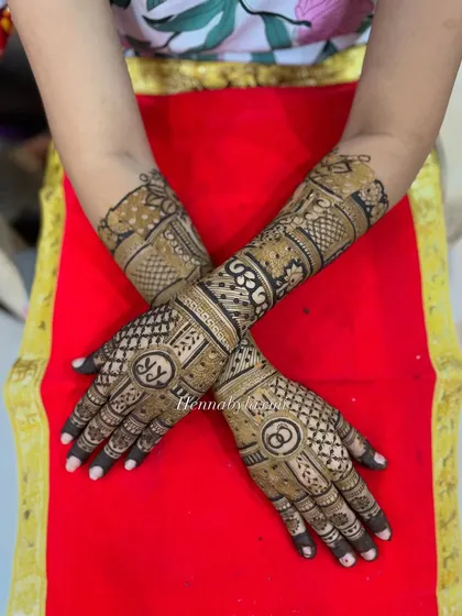 This full-coverage design for an engagement bride features initials and symbols, showing that you can have intricate, personalized art for every ceremony.