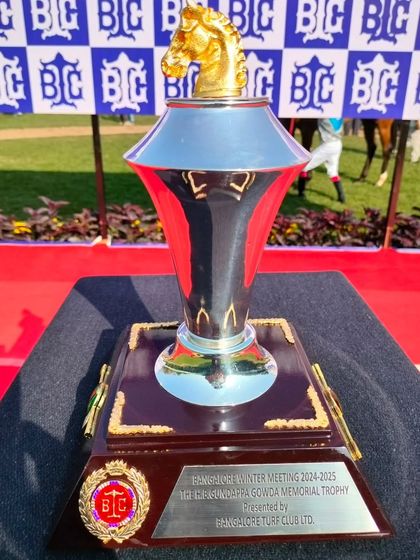 The H.B. Gundappa Gowda Memorial Trophy, featuring a golden horse head finial.