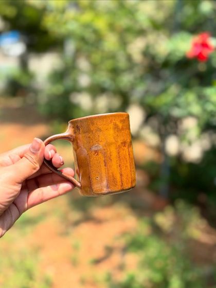 The Languid Magic glaze can vary so much depending on its placement in the kiln. This mug has a slightly lighter, more golden hue.