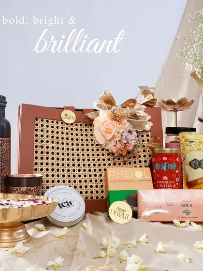 A gift should be an experience. I love curating a collection of bold, bright, and brilliant items that come together to tell a story, like this assortment featuring gourmet treats, artisanal chocolates, and fragrant wellness products.