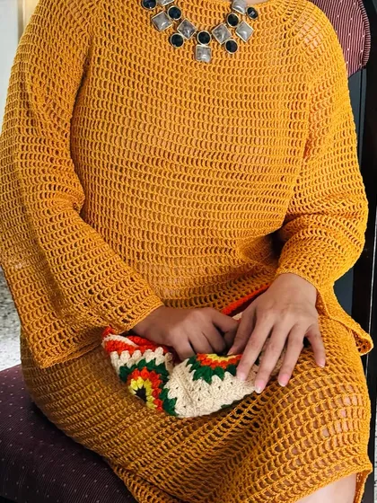 Here you can see how the mustard dress drapes when sitting. I focus on making sure my pieces are not just beautiful but also comfortable and easy to wear in real-life situations.