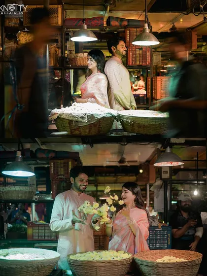 A behind-the-scenes feel at the flower market. The motion blur of people passing by emphasizes the couple as a calm center in the midst of the city's energy.