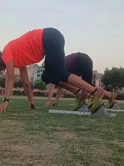 We train on all surfaces to build versatile and resilient athletes. Here, sprinters practice their starts on grass, which builds raw power and strengthens the legs.