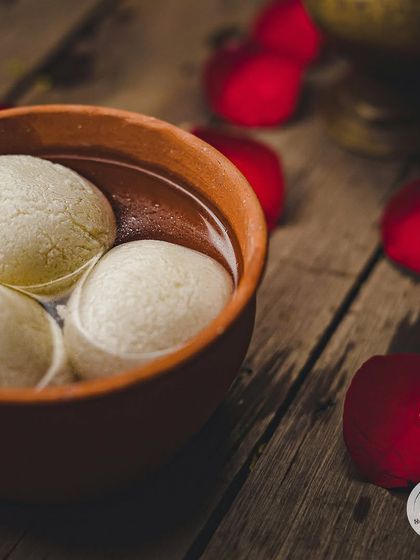 Our Sponge Rasgulla, soft and juicy, soaked in a light sugar syrup. These are incredibly light and refreshing, served chilled in an earthen bowl.