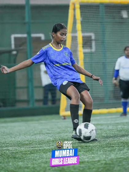 A girl in our blue and yellow kit controls the ball with precision during a league game. Her composure on the ball is proof that investing in girls' football unlocks limitless potential.