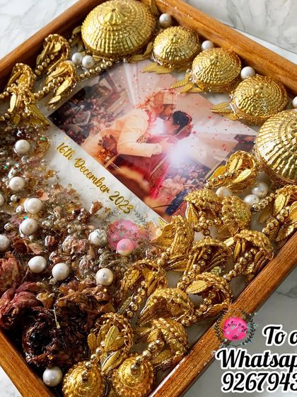 A different angle of the kaleera and varmala preservation frame, showing the beautiful depth and dimension created by the layered items.