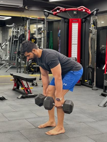 Barefoot deadlifts in the gym. Connecting with the ground helps with stability and form.