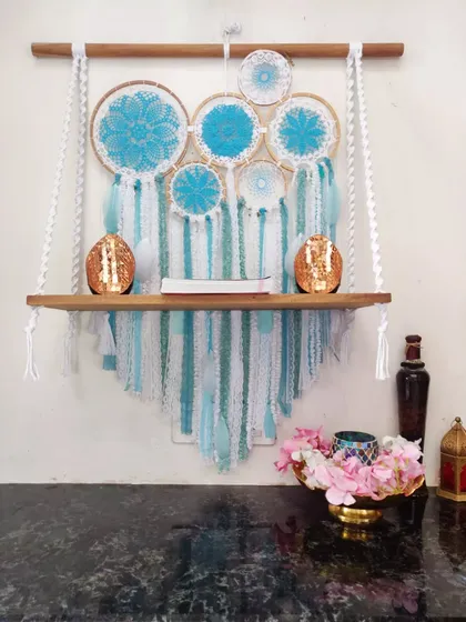 A client came to us with a unique idea for a shelf combined with a dreamcatcher backdrop, and we loved bringing it to life. This functional piece of art in calming blue tones is one of our favorite custom projects.