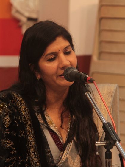 A senior student delivering a powerful and emotive bhajan performance.