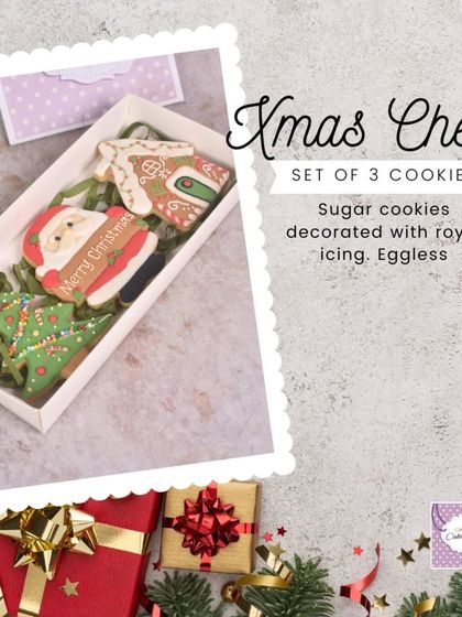 Our 'Xmas Cheer' set includes three decorated sugar cookies: a gingerbread house, a Christmas tree, and a Santa. A perfect little gift box.