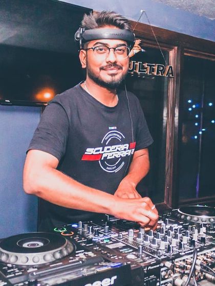 A shot from a night at the club, focused and ready. As a DJ, you have to be a masterpiece of concentration, reading the crowd and selecting the next track to keep the energy high.