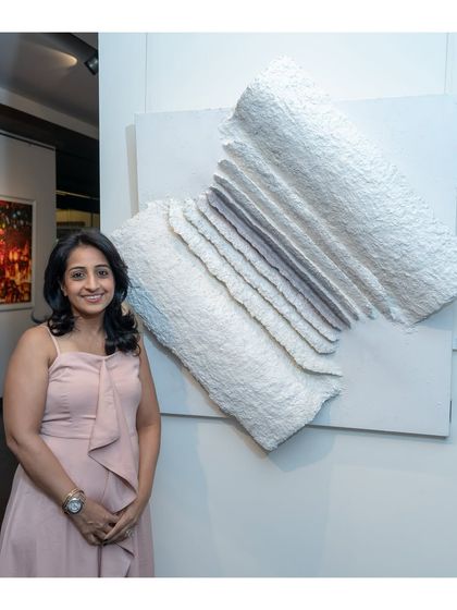 Here I am with "The Flight of Knowledge." This piece embodies the journey of wisdom, with each fold representing a chapter of learning that gives us wings to fly.