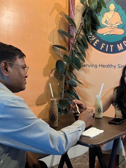 A candid moment between customers at my cafe. I love creating a space where people can connect over good, healthy food.