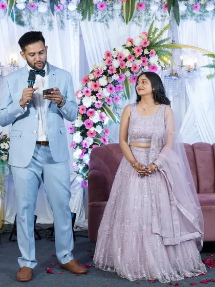The groom delivers a heartfelt speech to his bride on the stage during their engagement or reception party.