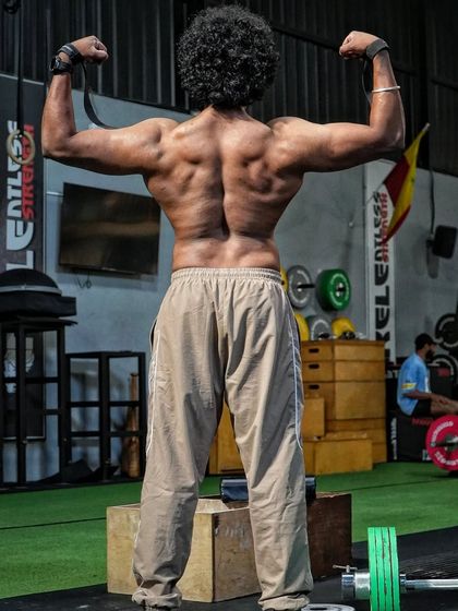 A deadlifter's back. This is built from years of pulling heavy weight off the floor. Deadlift is a leg-dominant exercise, but you can't move big numbers without a strong back to support the load.