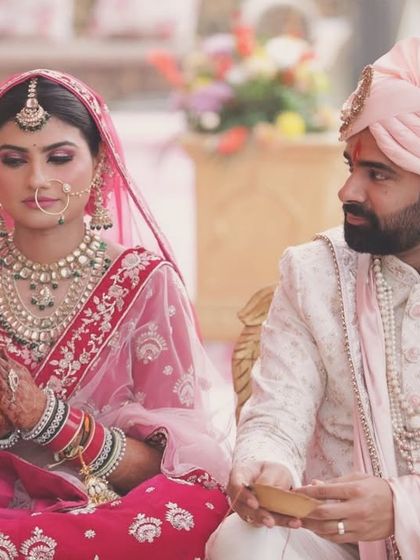 A beautiful candid of the bride and groom during the ceremony. The bride's calm expression shows her satisfaction with her look.