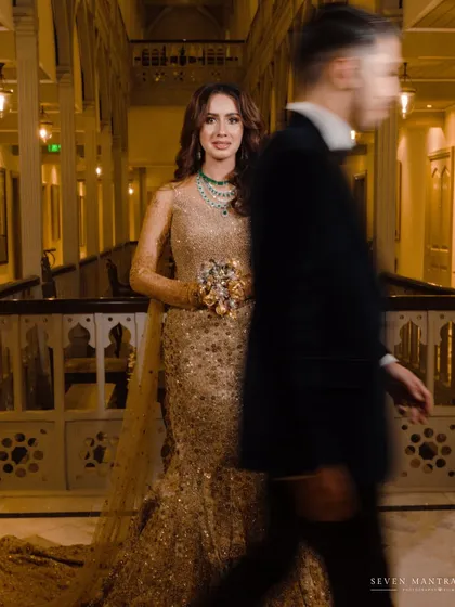 A fleeting moment, a lasting impression. I directed this shot with the groom in motion to create a sense of story and anticipation, leaving the bride as the stunning, still focal point in her golden Tarun Tahiliani gown.