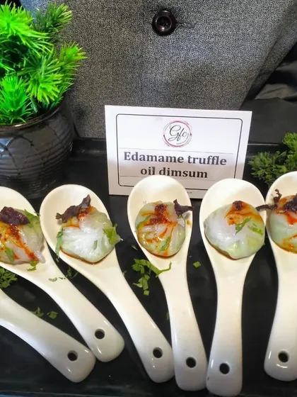 Our Edamame Truffle Oil Dimsum is a gourmet experience in a single bite. The delicate wrapper gives way to a burst of earthy, savory flavor.
