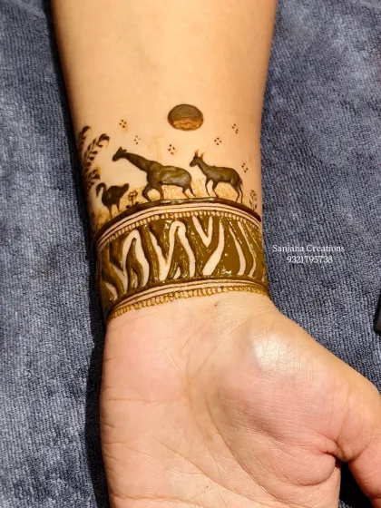 The completed safari wristband with a zebra-print pattern, adding a fun and wild touch to the overall baby shower design.