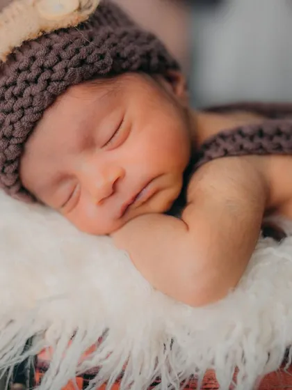 The sweet, sleepy face of a brand new adventurer. I love capturing the delicate details, from tiny eyelashes to soft cheeks, during my newborn photography sessions.
