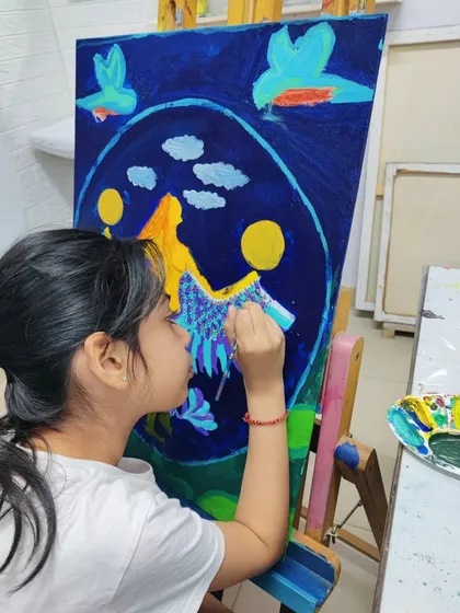 These images document the creation of a whimsical mermaid painting, showing the layering of colors and development of the composition.