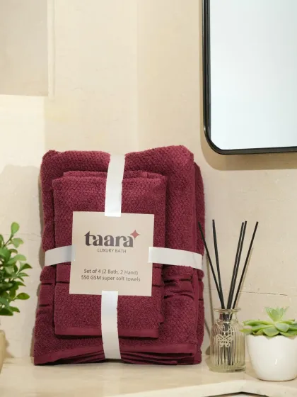 A set of maroon towels in the same vertical display. This helps customers compare colors in the exact same setting.