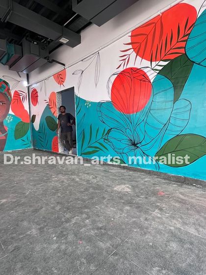 This vibrant boho art in Vijayawada combines an abstract portrait with bold floral and geometric shapes. Even simple designs can completely uplift the ambiance of a space.