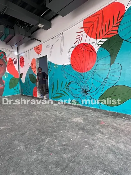 This vibrant boho art in Vijayawada combines an abstract portrait with bold floral and geometric shapes. Even simple designs can completely uplift the ambiance of a space.