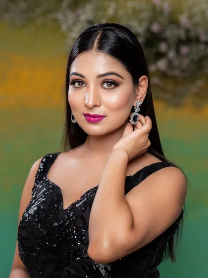 A bold and glamorous look from a portfolio shoot. This style features dramatic smokey eyes and a vibrant magenta lip, perfect for a western-style evening gown at a cocktail party or reception.