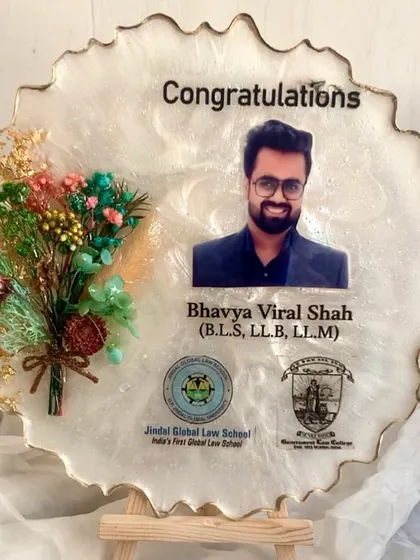A graduation frame celebrating a major achievement. I included the university logos along with the photo and a congratulatory message.
