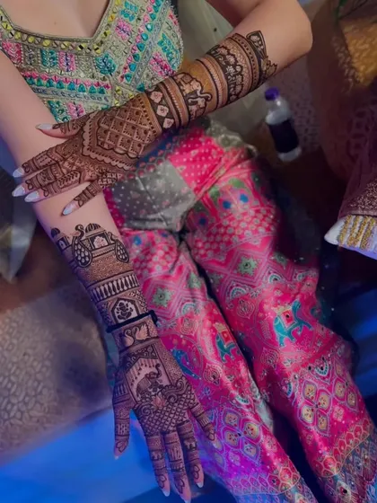 This bridal mehandi tells a story with figures of a doli and elephants, symbolizing the wedding journey. The details are sharp and clear, showcasing our precision.