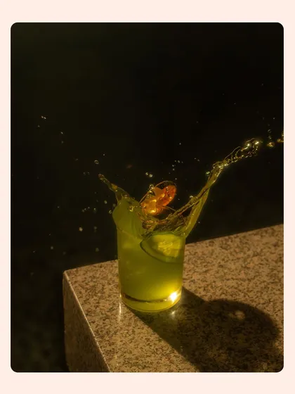 Capturing the perfect splash is a technical skill I love to use for beverage photography. This moody shot highlights the drink's refreshing quality and creates a premium feel for a cocktail menu.