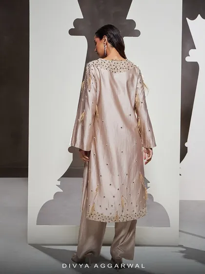 The back view of the Dara Kurti Set, showcasing the clean lines and the continuation of the hand embellishments along the hem.