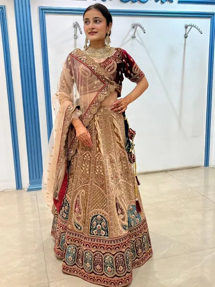 The combination of velvet and intricate embroidery gives this lehenga a truly royal feel.