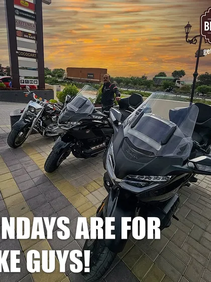 Sundays are for the riders. This image captures a trio of large touring motorcycles, including a Honda Goldwing, enjoying a sunset stop.