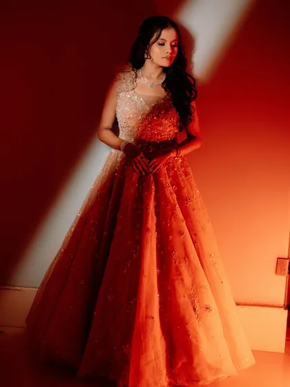 A full-length view of the bride's gorgeous red sangeet gown.