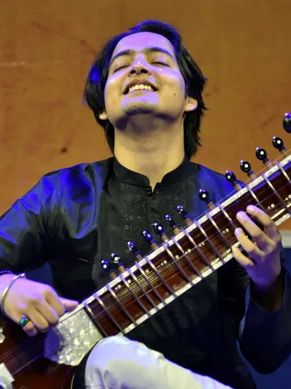 Eyes closed, fully absorbed in the melody. This is what it feels like when the music takes over on stage.