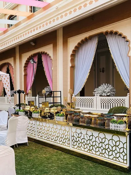 Capturing the royal essence of Rajasthan, this outdoor buffet setup was designed for a destination wedding in Jaipur. The intricate patterns and traditional architecture of the venue are complemented by my elegant catering stations.