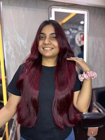 For clients who love a bold statement, a vibrant cherry red is a fantastic choice. I make sure the color is rich, even, and incredibly glossy, giving you a fun and festive look that truly shines.