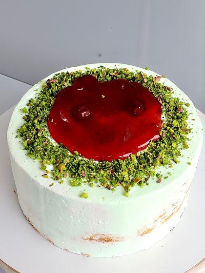 My Raspberry Pistachio Naked Cake is a symphony of flavors. I pair a soft pistachio sponge with a tangy fresh raspberry compote and a creamy pistachio white chocolate ganache. It's a sophisticated combination for those who appreciate a balance of nutty and tart.