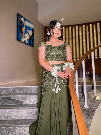 Green and gorgeous! My beautiful bride Simi chose a dreamy Mehendi look with an olive green lehenga and floral jewelry. The makeup was kept soft and glowing to complete the magical vibe.